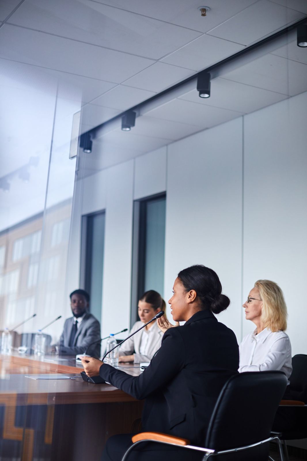 Leaders in discussion around a conference table